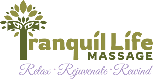 A green banner with the words tranquil life massage written in purple.